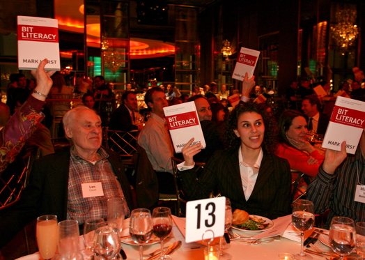 Books being held up by readers